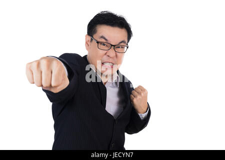 Angry Asian Chinese man wearing suit and holding both fist in isolated white background. Stock Photo