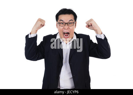 Angry Asian Chinese man wearing suit and holding both fist in isolated white background. Stock Photo