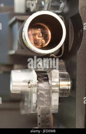 Close Up Film Carriage and Lens Vintage 8mm Movie Projector Stock Photo