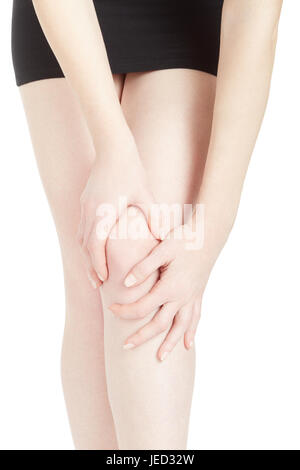 Young woman with black skirt suffering from knee pain isolated on white, clipping path Stock Photo