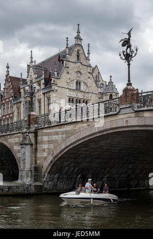 A group of tourists visits Ghent historic district in a boat Stock Photo