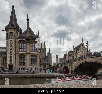 A group of tourists visits Ghent historic district in a boat Stock Photo