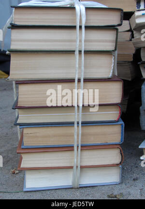 A stack of books tied with a white rope Stock Photo