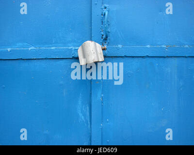 Blue metal door with lock close-up Stock Photo