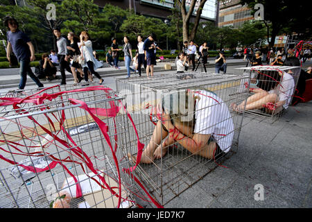 Seoul, South Korea. 24th June, 2017. Animal rights group activists are performing a memorial service to console the animals killed by the slaughter on the Gwanghwamun street. Credit: Min Won-Ki/ZUMA Wire/Alamy Live News Stock Photo