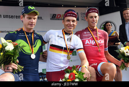 Chemnitz, Germany. 23rd June, 2017. Tony Martin of the team Katusha Alpecin is the winner of the men's single time trial during the German Cycling Championships in Chemnitz, Germany, 23 June 2017. On second place is Jasha Sütterlin (L) of Team Movistar and on third Nils Politt from the Team Katusha Alpecin. Photo: Hendrik Schmidt/dpa-Zentralbild/dpa/Alamy Live News Stock Photo