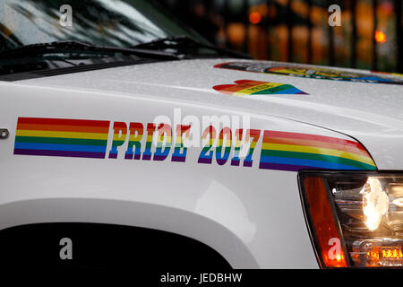 New York, USA. 23rd June, 2017. A police cruiser, in rainbow trim, stands guard in front of the Stonewall Inn in New York City's Greenwich Village where the Gay Pride movement was born, following a series of demonstrations in response to a police raid of the bar in 1969.  People are flocking to the site, now a National Monument, as Gay Pride events get underway in New York City this weekend, including Sunday's Pride march. Credit: Adam Stoltman/Alamy Live News Stock Photo