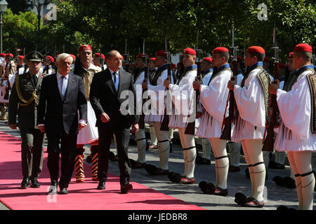 Athens. 23rd June, 2017. Greek President Prokopis Pavlopoulos (front L) and his Bulgarian counterpart Rumen Radev (front R) inspect a guard of honour at a welcome ceremony outside the presidential palace in Athens, Greece on June 23, 2017. Greece warmly supports the integration of neighboring countries in the European Union (EU) and NATO as long as prerequisites are met, Greek President Prokopis Pavlopoulos said on Friday while welcoming Bulgarian President Rumen Radev in Athens. Credit: Marios Lolos/Xinhua/Alamy Live News Stock Photo
