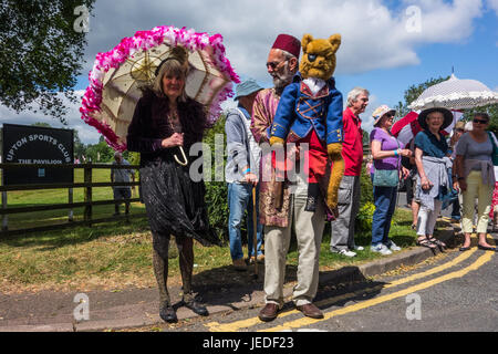 Upton Upon Severn, UK. 24th June, 2017. 'Coinwolf' the one legged puppet who is the oficial mascot for the Upton Folk Festival lost his leg during the Battle of Worcester. Seen during the Mardi Gras style jazz Parade on june 24th 2017 Credit: Jim Wood/Alamy Live News Stock Photo