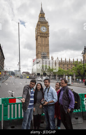 London, UK. 24th June, 2017. Tourists take a selfie photo in front of a crane and scaffolding currently being erected on Westminster’s Parliament buildings to begin the renovation process which could take 3 years. Credit: Guy Corbishley/Alamy Live News Stock Photo
