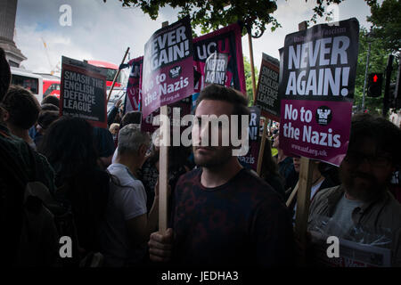 Trafalgar Square, London, UK. 24th June, 2017. Protestors from the EDL and UAF face off as they march from Trafalgar Square to Victoria Embankment. In picture, a protestor holds a placard.  © Byron Kirk Stock Photo