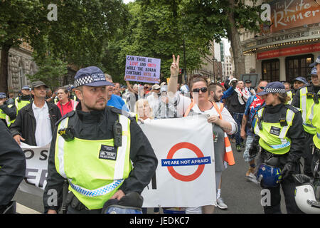 EDL march London, UK. 24th June, 2017. A EDL protester holding a banner on the way to the embankment Credit: Brian Southam/Alamy Live News Stock Photo