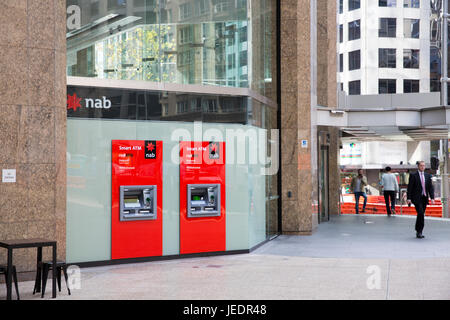 Nab bank branch in george street, Sydney city centre with ATM cash machines Stock Photo