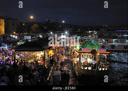 Turkey, Istanbul, part of town of Eminou, fish restaurants in the Golden Horn at night, Stock Photo