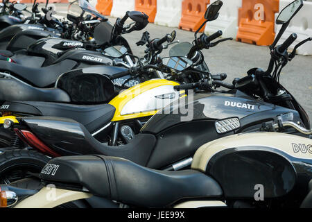 Ducati motorcycles and other brands are lined up in front of the Ducati dealership in the Soho neighborhood of New York on Wednesday, June 21, 2017. Harley-Davidson is reported to be preparing a bid for Ducati motorcycles in a bid worth $1.67 billion. Volkswagen is selling their Ducati brand and Bajaj Auto, an Indian motorcycle manufacturer and several buyout firms are also interested in the high performance bike company.  (© Richard B. Levine) Stock Photo