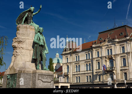 Bronze sculpture of national poet Preseren Monument with Muse and historic Kresija building with municipal offices and dome of Ljubljana Cathedral Stock Photo