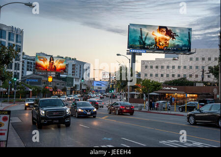 The Sunset Strip at dusk with lit billboards promoting the movie Wonder Woman in Los Angeles, CA. Stock Photo