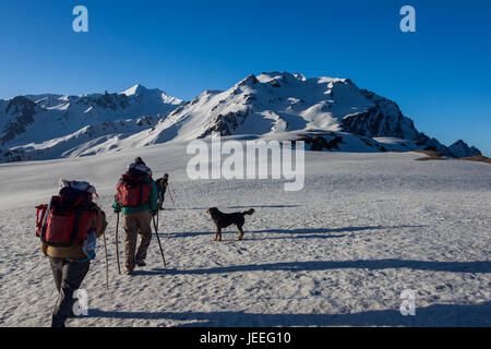 Group of trekkers hiking in Himalayas for Sarpass Trek in Kasol, Himachal Pradesh, India Stock Photo