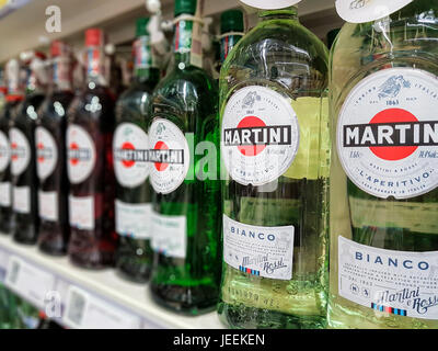 Nowy Sacz, Poland - June 16, 2017:Bottles of various types of Martini Bianco Vermouth on store shelves for sale in Tesco Hypermarket. Martini is a bra Stock Photo