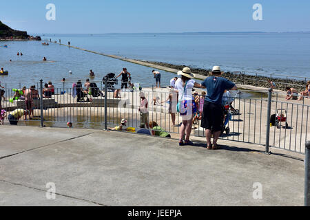 Summer seaside family visit to Clevedon marine lake, North Somerset, UK Stock Photo