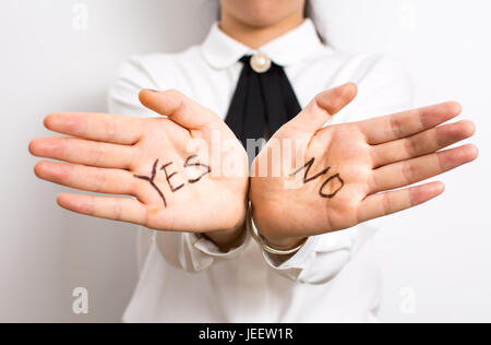 Yes or No? Words written on businesswoman hands Stock Photo