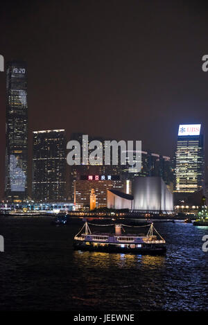 Vertical view of Tsim Sha Tsui in Hong Kong lit up at night, China. Stock Photo