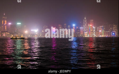 Horizontal panoramic view of Hong Kong Island in the fog lit up at night, China. Stock Photo