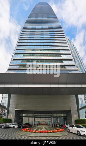 Vertical panoramic street level view of the entrance to the Ritz Carlton at the International Commerce Centre in Hong Kong, China. Stock Photo
