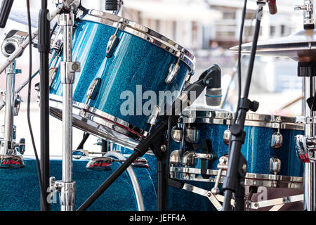 musical instruments closeup. modern drum set standing in the street stage for performance. Stock Photo