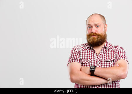 Bewildered man with ginger beard Stock Photo