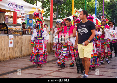 Dance group in Bolivian traditional costumes on food event, parade, International event Spain. Stock Photo