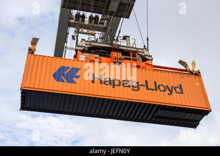 ROTTERDAM - SEP 6, 2015: Crane operator picking up a Hapag-Lloyd sea container in the Port of Rotterdam. Stock Photo