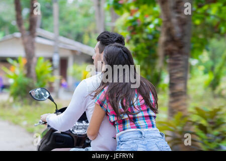 Couple Riding Motorcycle, Young Man Woman Tourist Travel Bike Tropical Forest Exotic Vacation Stock Photo