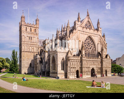 20 June 2017: Exeter, Devon, UK - The Cathedral Church of St Peter, Exeter, Devon, the seat of the Bishop of Exeter, with people walking and relaxing  Stock Photo