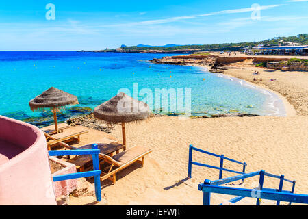 Steps from coastal bar to Cala Comte beach, Ibiza island, Spain Stock Photo