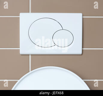 Economic toilet flush press with two separate buttons Stock Photo