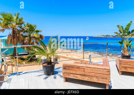 Benches on coastal promenade in San Antonio town on sunny summer day, Ibiza island, Spain Stock Photo