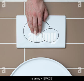 Economic toilet flush press with two separate buttons Stock Photo