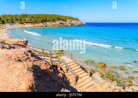 Wooden steps to Cala Nova beach on sunny summer day, Ibiza island, Spain Stock Photo