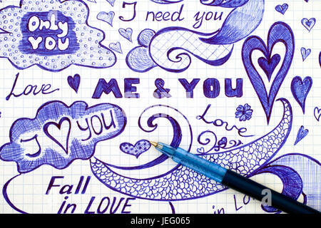 Hand drawn love doodles messages on checkered paper with ballpoint pen. Stock Photo