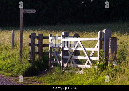 Wooden Farm Gate and Signpost Along a Country Path. Orcombe Point, Exmouth, Devon, UK. June, 2017. Stock Photo