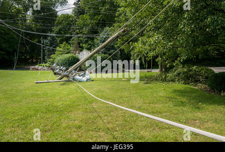 Snapped and downed power post and line after storm Stock Photo