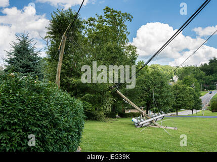 Snapped and downed power post and line after storm Stock Photo