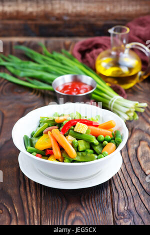 mix vegetables in bowl and on a table Stock Photo