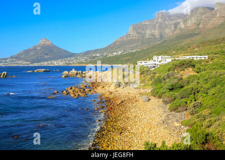 View of Sentinel peak in Hout Bay from the scenic Chapman's Peak Drive, Cape Town, South Africa in a sunny day. Stock Photo