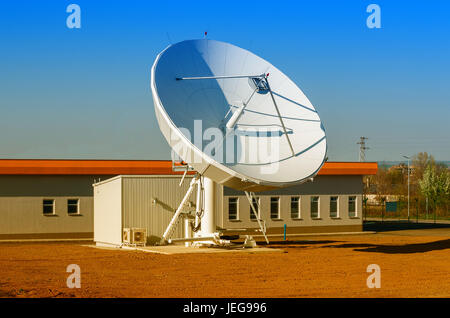 A large satellite dish for telecommunications industry aimed into space Stock Photo
