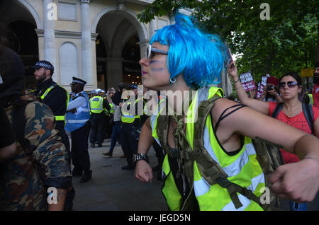 London, UK. 24th Jun, 2017. Clowning against fascism, the troupe explore space and movement in the centre of some what chaotic anti EDL protest . Credit: Philip Robins/Alamy Live News Stock Photo