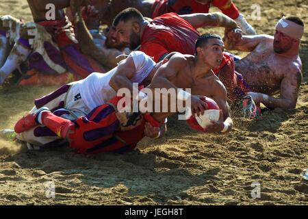 Florence, Italy. 24th June, 2017. Players compete during the final match of the Calcio Storico Fiorentino traditional 16th Century Renaissance ball game at Santa Croce square in Florence, central Italy, June 24, 2017. Calcio Storico Fiorentino, an early form of football from the 16th century, originated from the ancient roman 'harpastum'. Credit: Jin Yu/Xinhua/Alamy Live News Stock Photo
