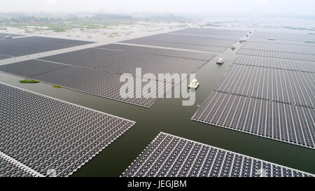 Beijing, China. 22nd June, 2017. Photo taken on June 22, 2017 shows the PV power station floating on waters of the coal mining subsidence area in Huainan City, east China's Anhui Province. Credit: Guo Chen/Xinhua/Alamy Live News Stock Photo