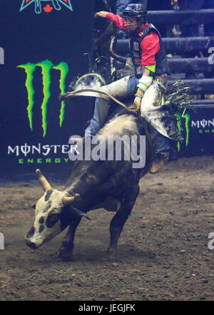 (170625) -- TORONTO, June 25, 2017 (Xinhua)-- Cowboy Dakota Buttar of Canada competes during the competition of the 2017 Professional Bull Riders (PBR) Monster Energy Canada Tour at Ricoh Coliseum in Toronto, Canada, June 24, 2017. (Xinhua/Zou Zheng)(wll) Stock Photo